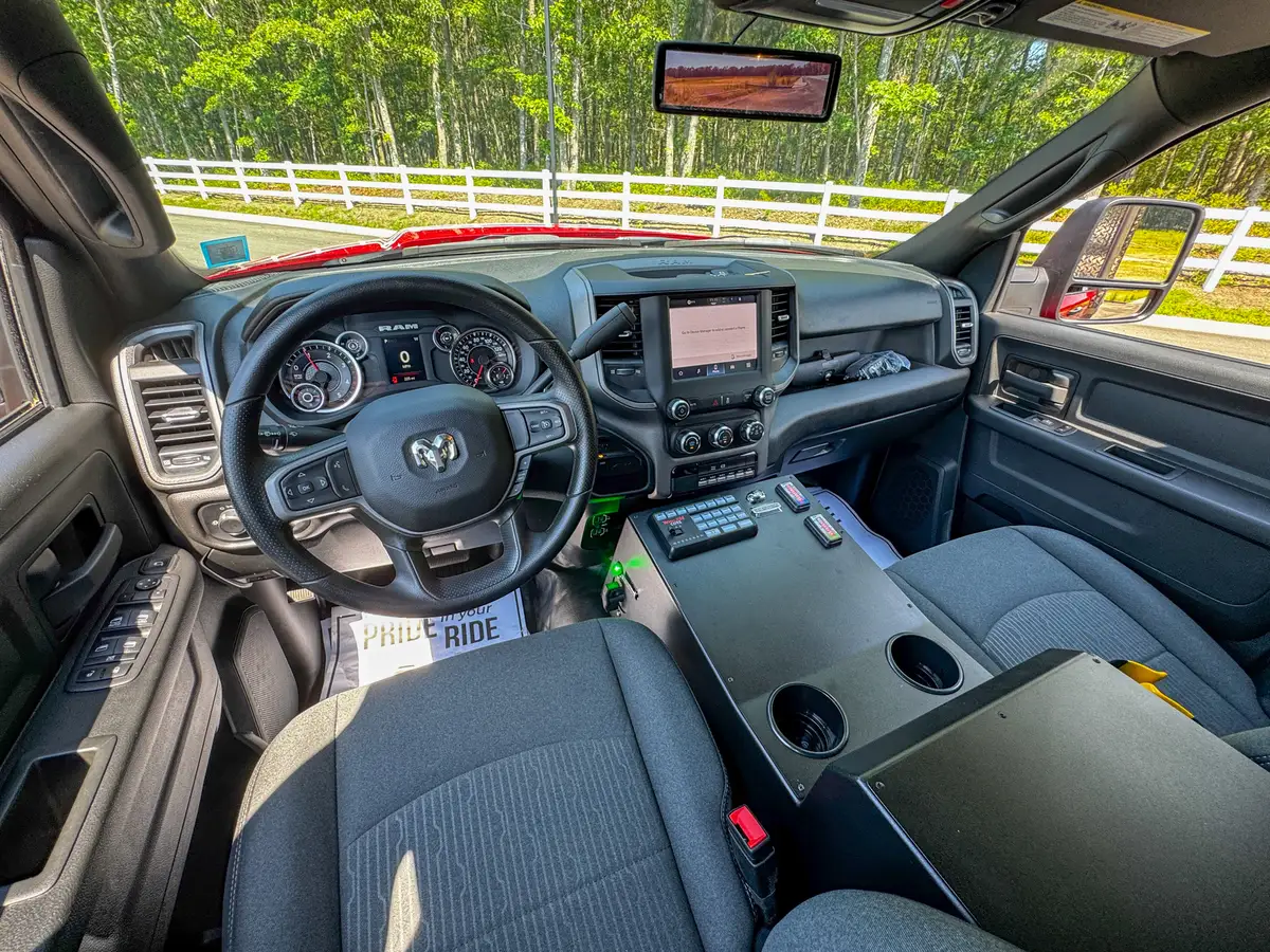Rear-view mirror display close-up showing camera feed in the cabin.